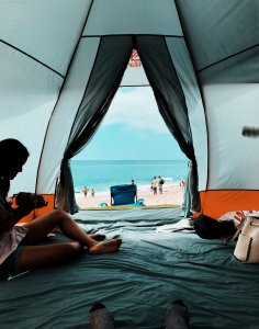 girl in camping tent by the beach Girl in camping tent by the beach