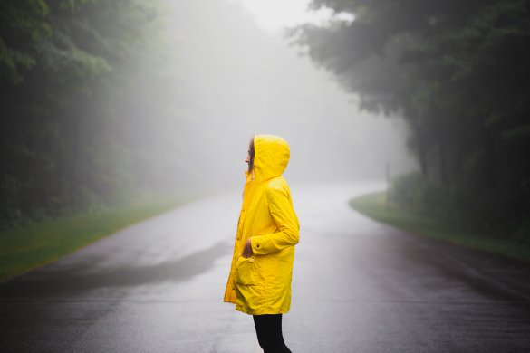 alesia-kazantceva-yiJTuGp3L8o-unsplash Girl in a foggy road with a yellow raincoat