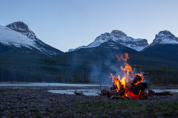 courtnie-tosana-brqqSBSXPac-unsplash Campfire next to a lake on the mountains